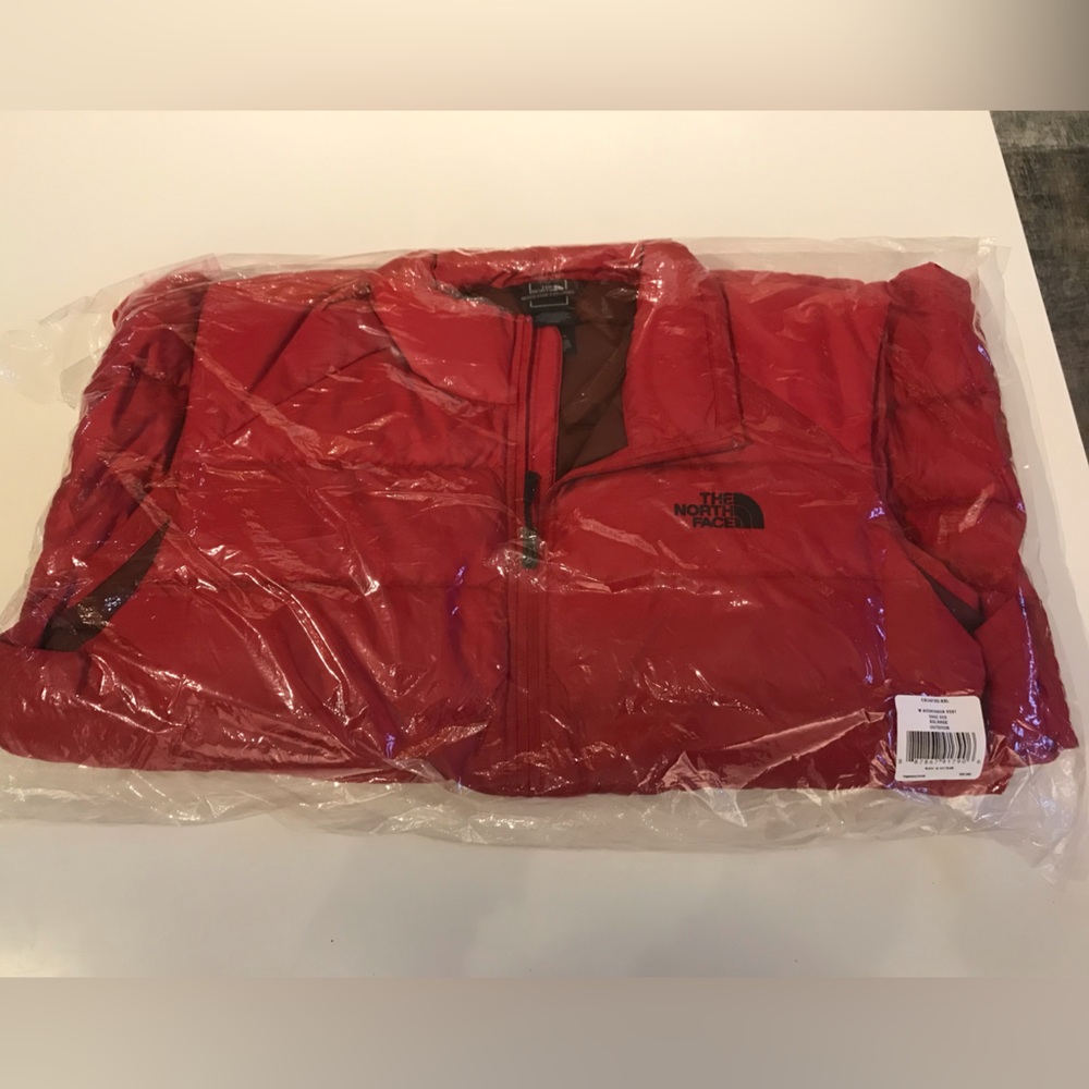 Red North face puffy vest. New with tags. XXL